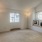 Bedroom with a window seat and two windows